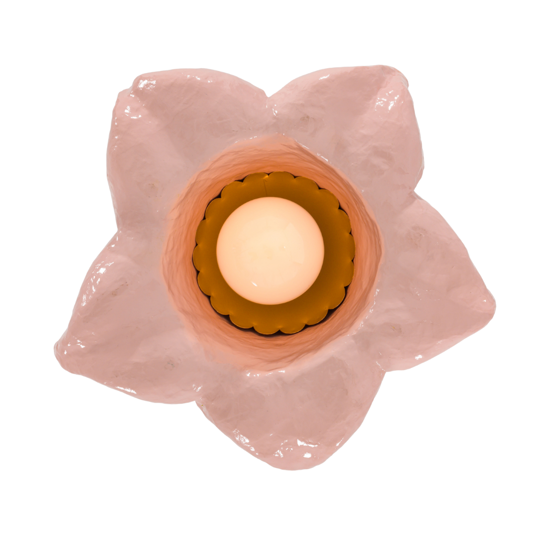 underside of a pink and chartreuse floral pendant light on a white background