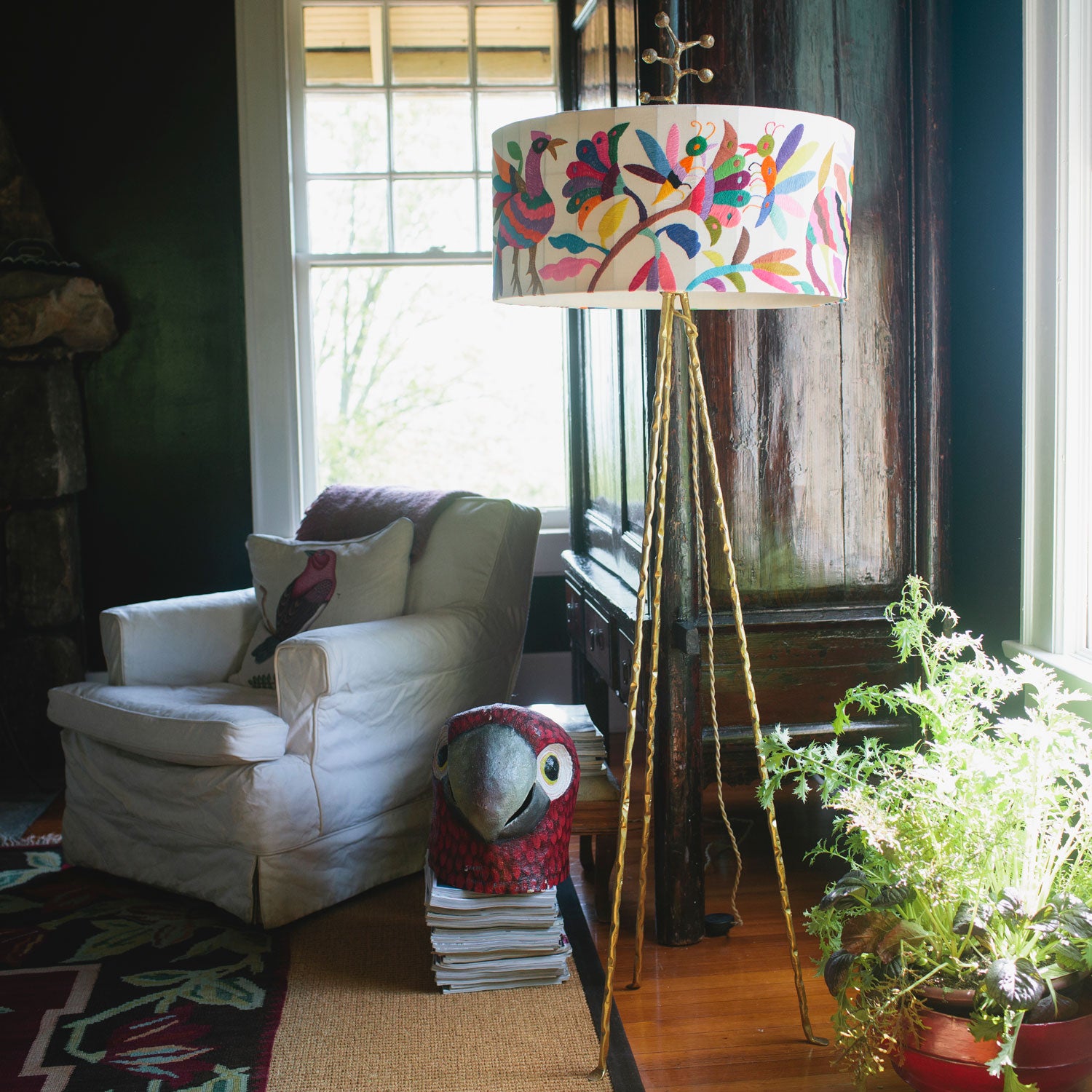 floor lamp in Mexican art style with bright otomi embroidery around lamp shade