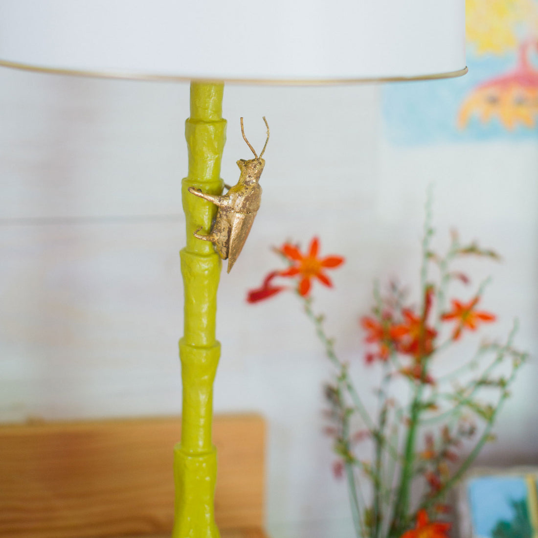 Gold Bug Lamp is handmade from paper mache and has a matal shade