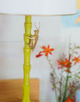 Gold Bug Lamp is handmade from paper mache and has a matal shade