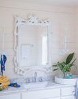 Magalie Mirror in a beachy bathroom, artisan made from papier mache.