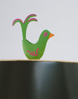 Green bird finial on black Mrs English light by Stray Dog Designs