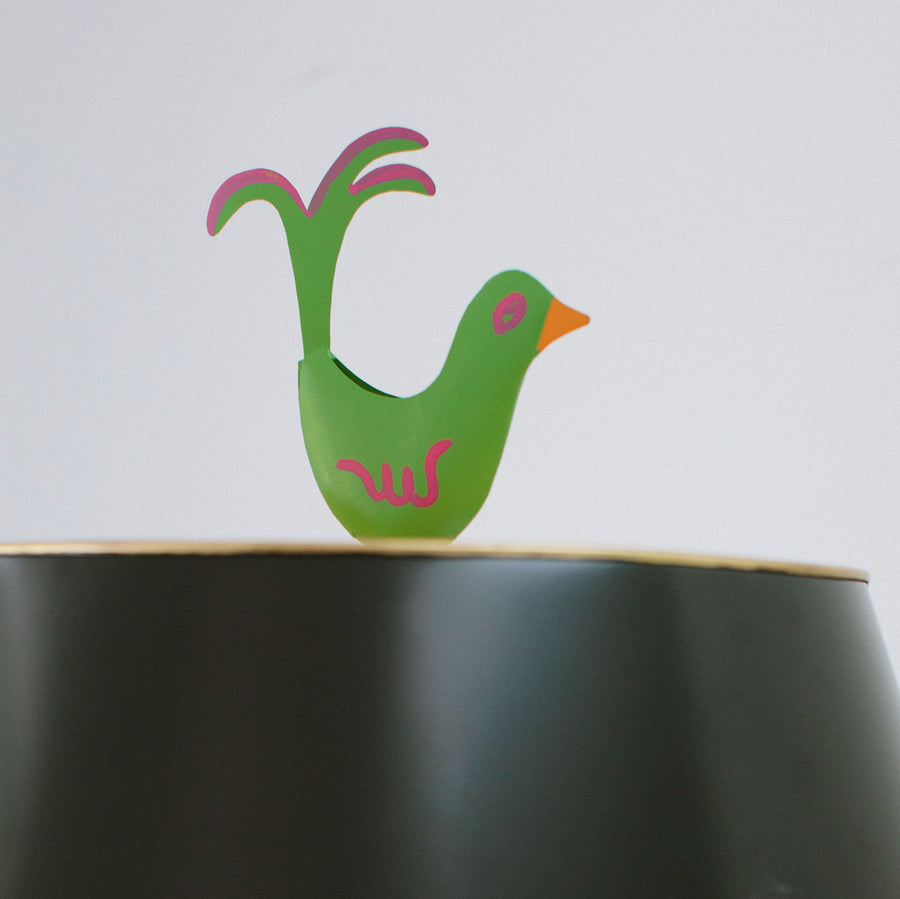 Green bird finial on black Mrs English light by Stray Dog Designs