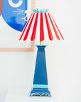 red and blue Norma Lamp, Stray Dog Designs, striped shade, flower top