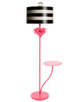 Pink papier mache floor light with black and white striped shade.